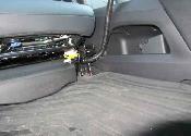Bend up and inward to allow seat to slide.